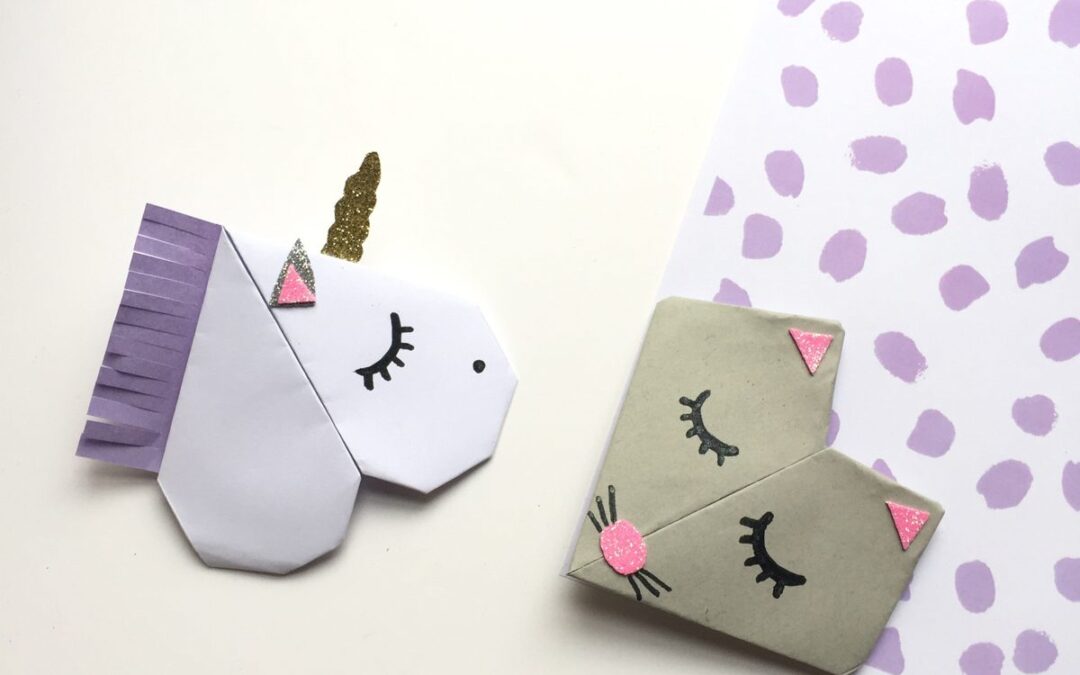 Marque-pages coins de page en origami en forme d'animaux colorés, posés sur un livre